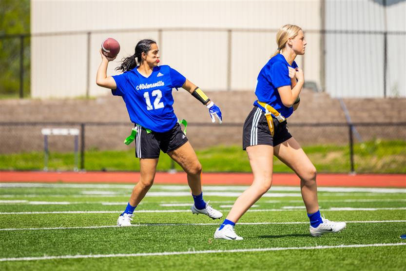 Students play flag football